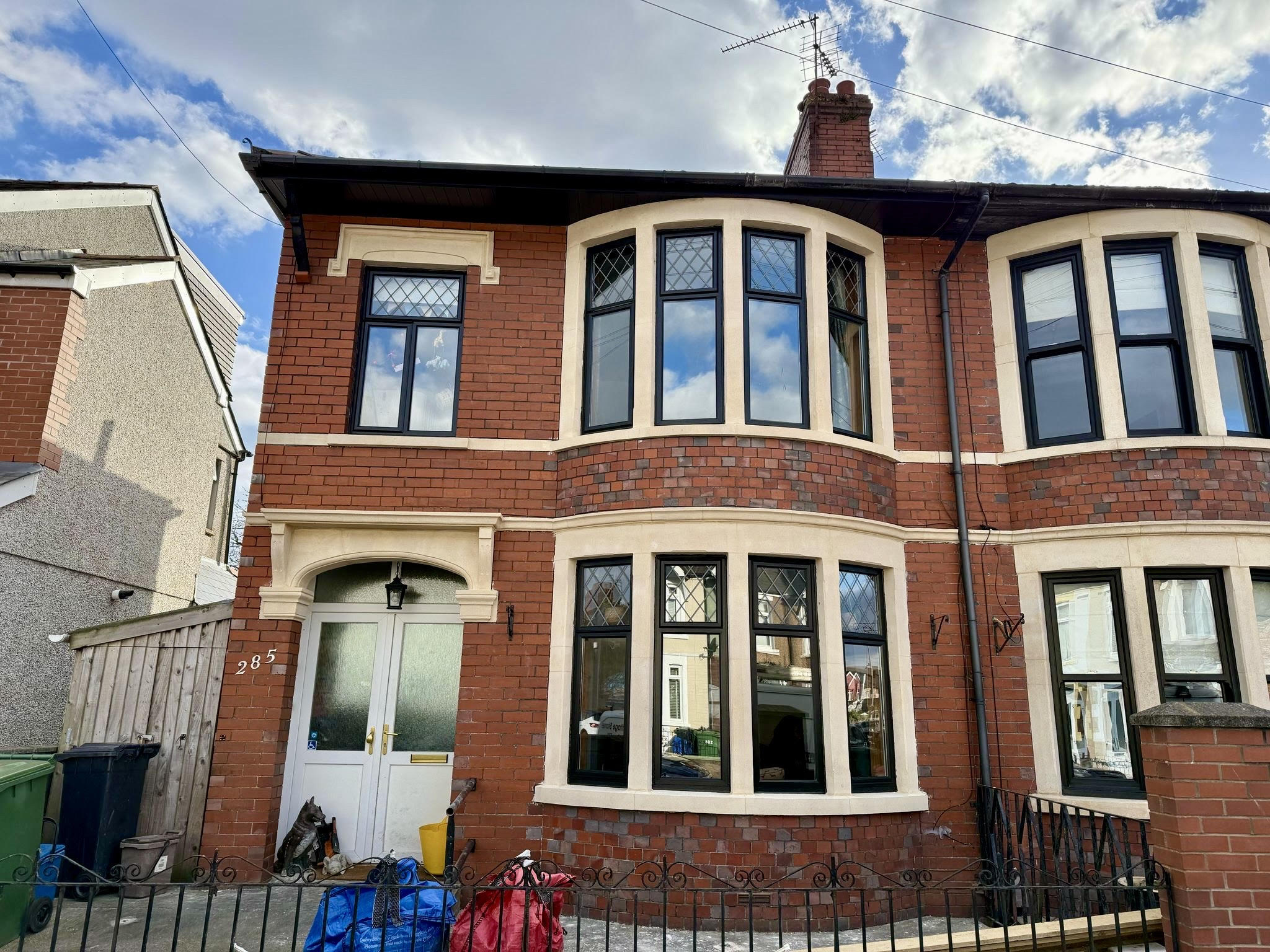 Restored bath stone facade showcasing the high-quality craftsmanship and detailed restoration work on a Cardiff property.